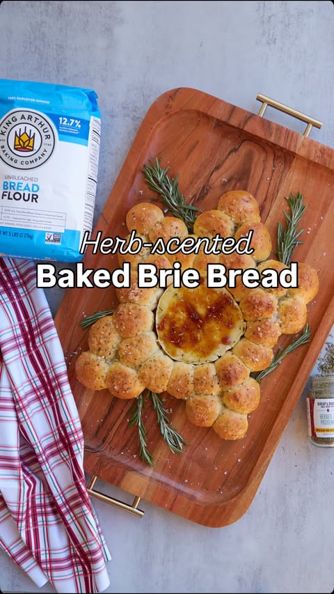 Instagram post by @countryroadssourdough for King Arthur Baking Company. Caption reads: You have to try this Herb-Scented Baked Brie Bread....