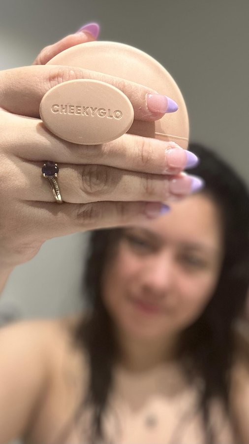 Instagram post by @holly_meza for Cheekyglo. Caption reads: The CheekyGlo Scalp Scrubber 💕 - code: [...].