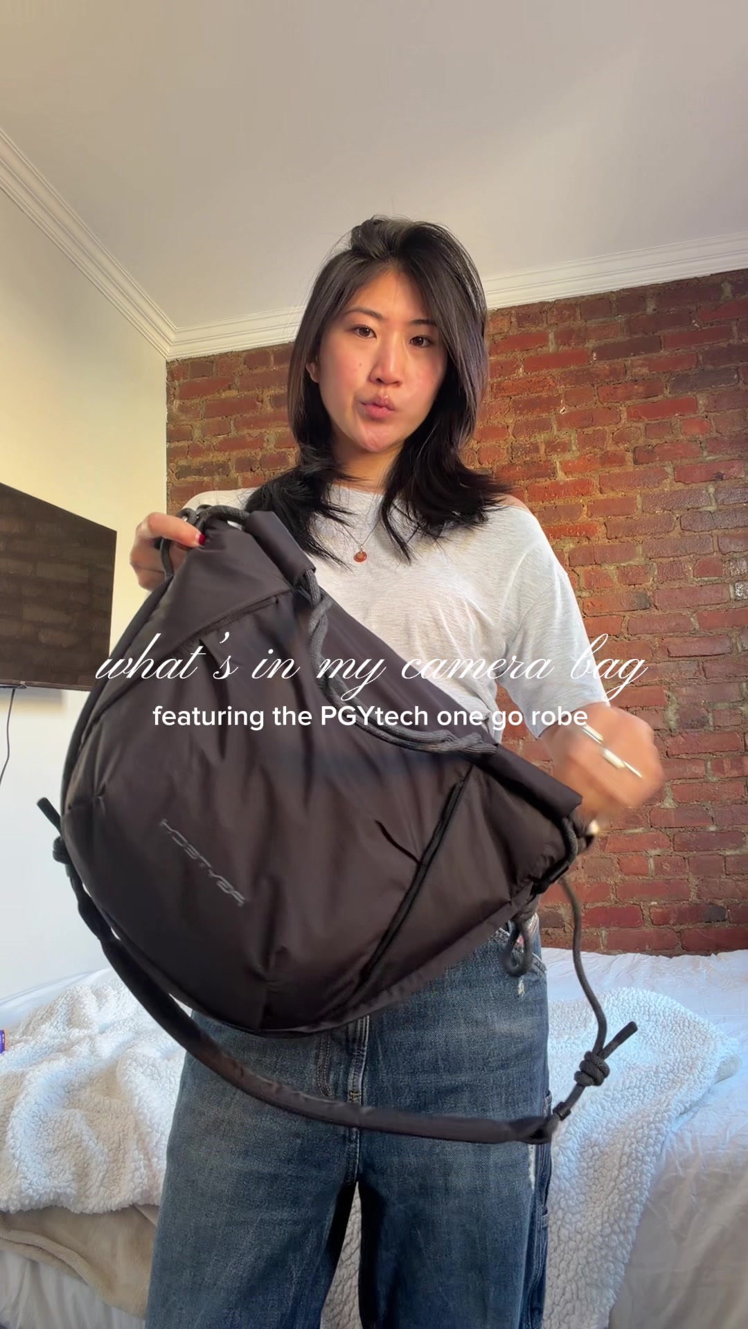 TikTok post by @kaylacunanann for PGYTECH. Caption reads: [...] casual and comfortable camera bag🎞️....