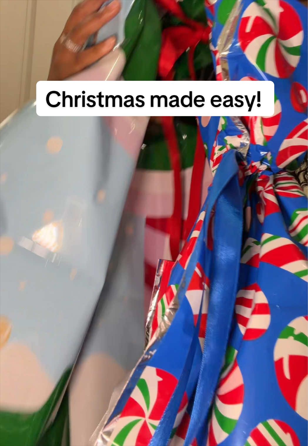 TikTok post by an influencer for QVC. Caption reads: [...] ! #kringleexpress #giftbags #qvc....
