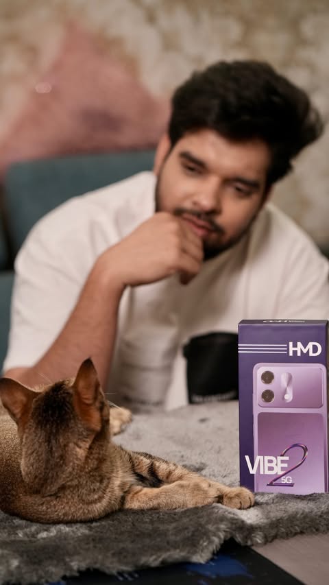 Instagram post by @shivadityabarjatya for HMD. Caption reads: • Budget tight but vibe high? Meet the HMD Vibe 2....