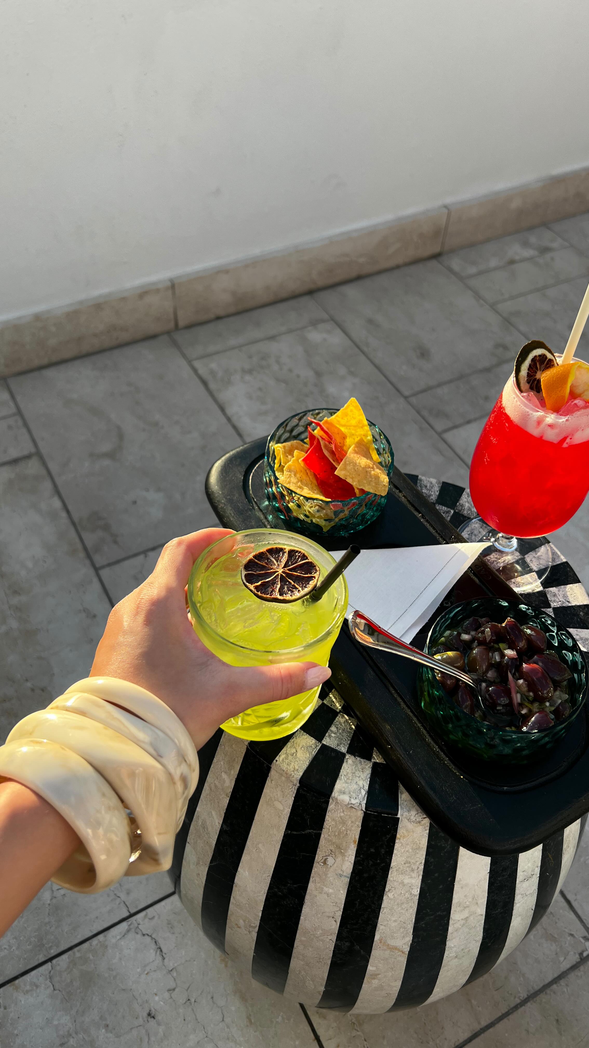 Instagram post by @charlenetruong for Rakuten. Caption reads: What’s in my travel bag ✈️ ft. @rakuten - Head to....