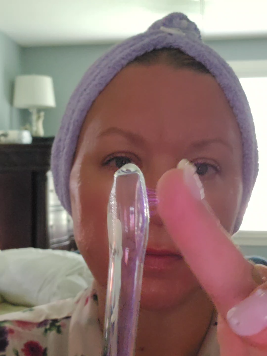 TikTok post by @tink0478 for Pure Daily Care NuDerma Wand. Caption reads: [...] on those lines with this one.@Pure Daily....