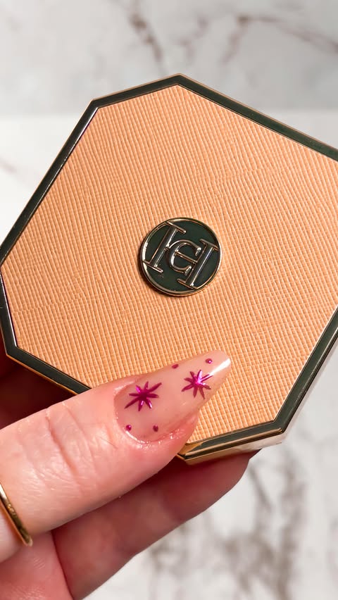 Instagram post by @alifewithfrills for Carolina Herrera. Caption reads: The @carolinaherrera Nude Couture Highlighter in....