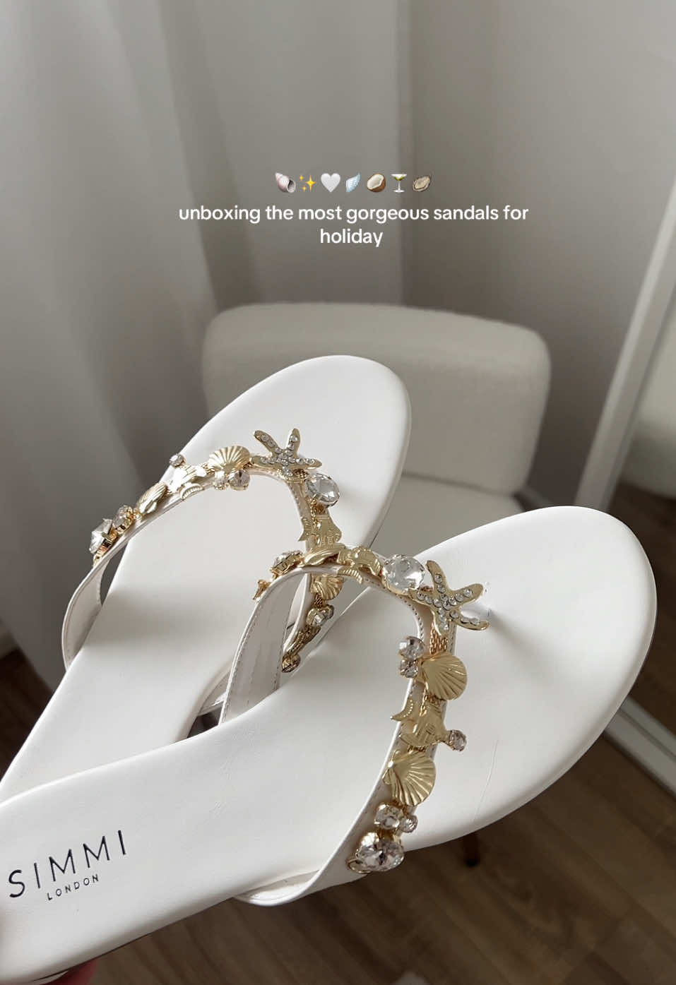 TikTok post by @sashxrose for Simmi London. Caption reads: the gold details 🥹✨🐚 @SIMMILONDON #sandals....