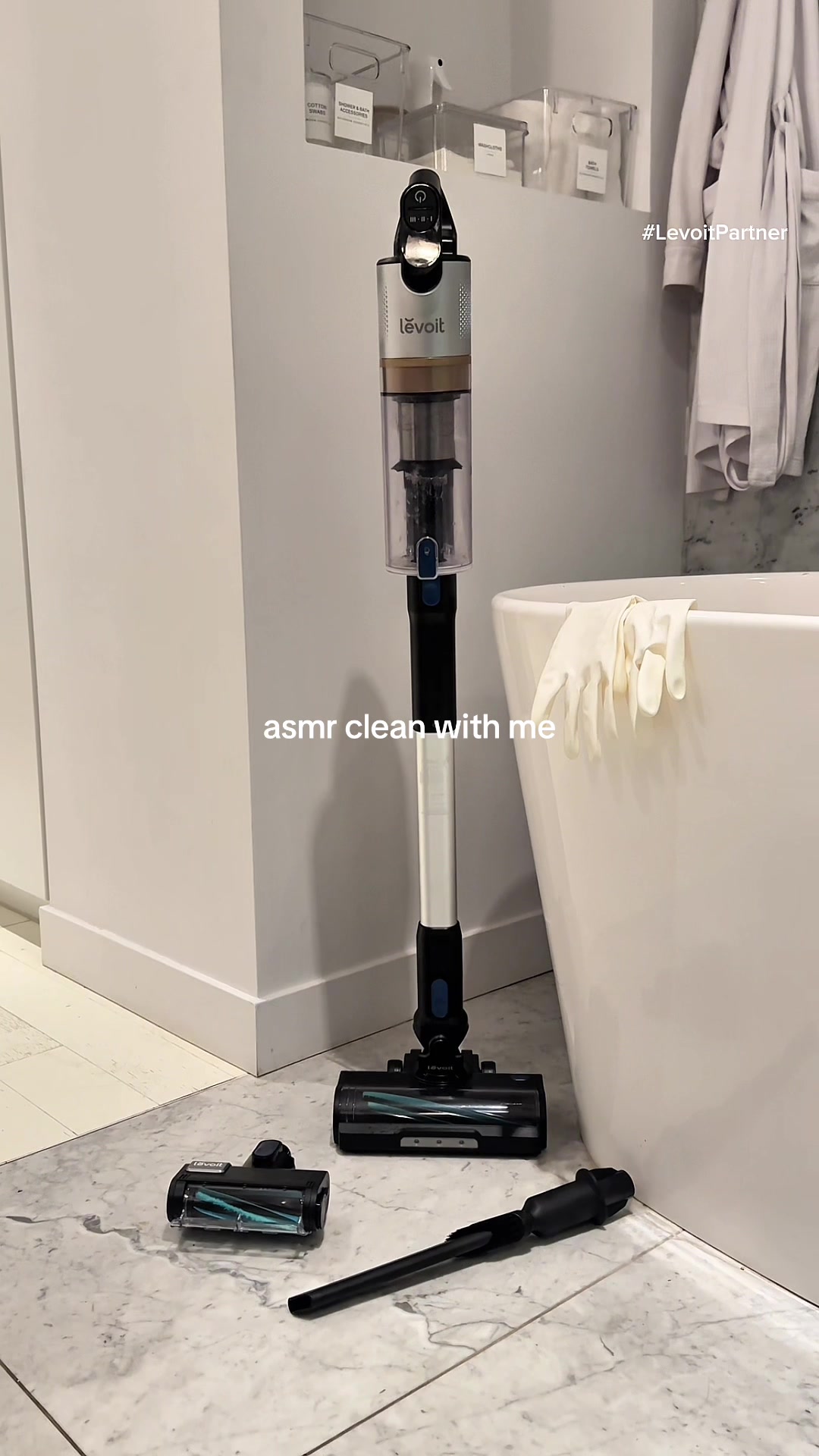 TikTok post by @galicia_gordon for Levoit. Caption reads: asmr clean with me ft. @Levoit_official LVAC 300....