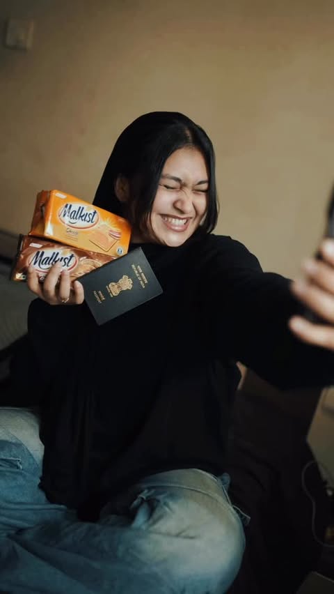 Instagram post by @fathimaa.noufa for Malkist Premium Crackers. Caption reads: ✈️✨ Off to Kuwait… and guess who’s coming with me?....