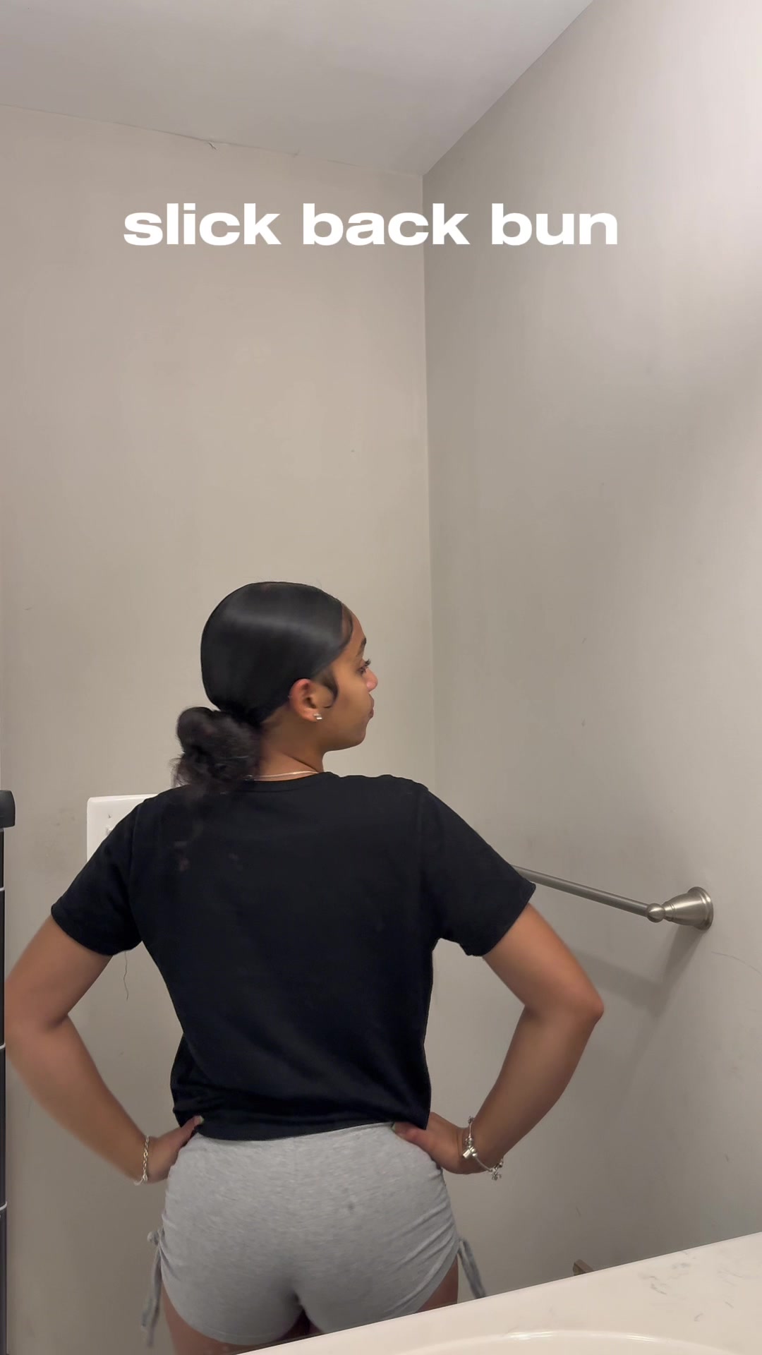 TikTok post by @pretty.niylaa for Dolahair. Caption reads: slick back bun using @DOLAHAIRCARE wax stick! This....