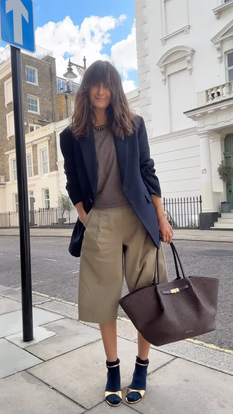 Instagram post by @carolinesstylehacks for DeMellier. Caption reads: [...] ♥️ Kept the socks on 😀🤎 new bag love....