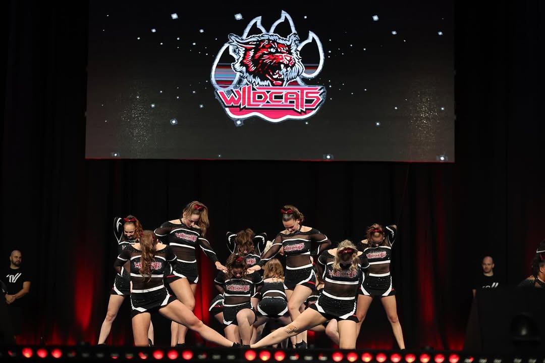 Instagram post by @wildcatsleverkusen for Varsity Spirit. Caption reads: Wildcats Xclusive took off to Sweden for the....