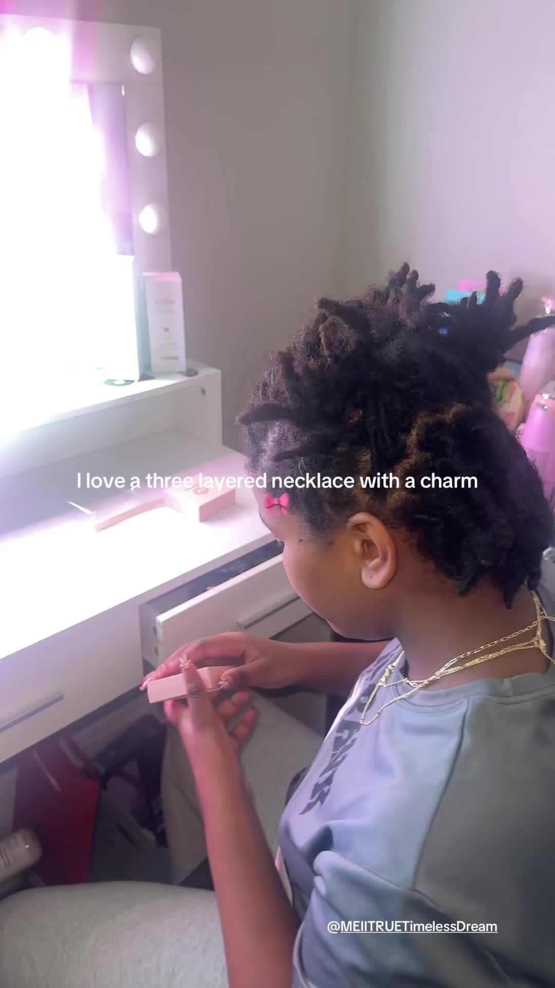 TikTok post by @carmonaclan for TimelessDream. Caption reads: Three necklaces in one with a bow charm. It’s....