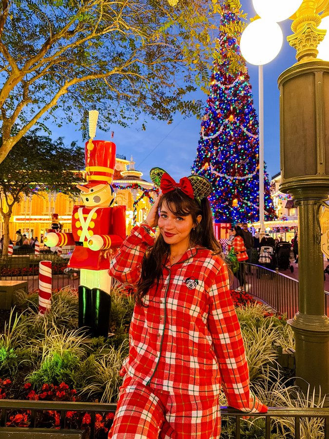 Instagram post by @magicwithmeg for Undercover Tourist. Caption reads: comfy and cozy at mickey’s very merry christmas....