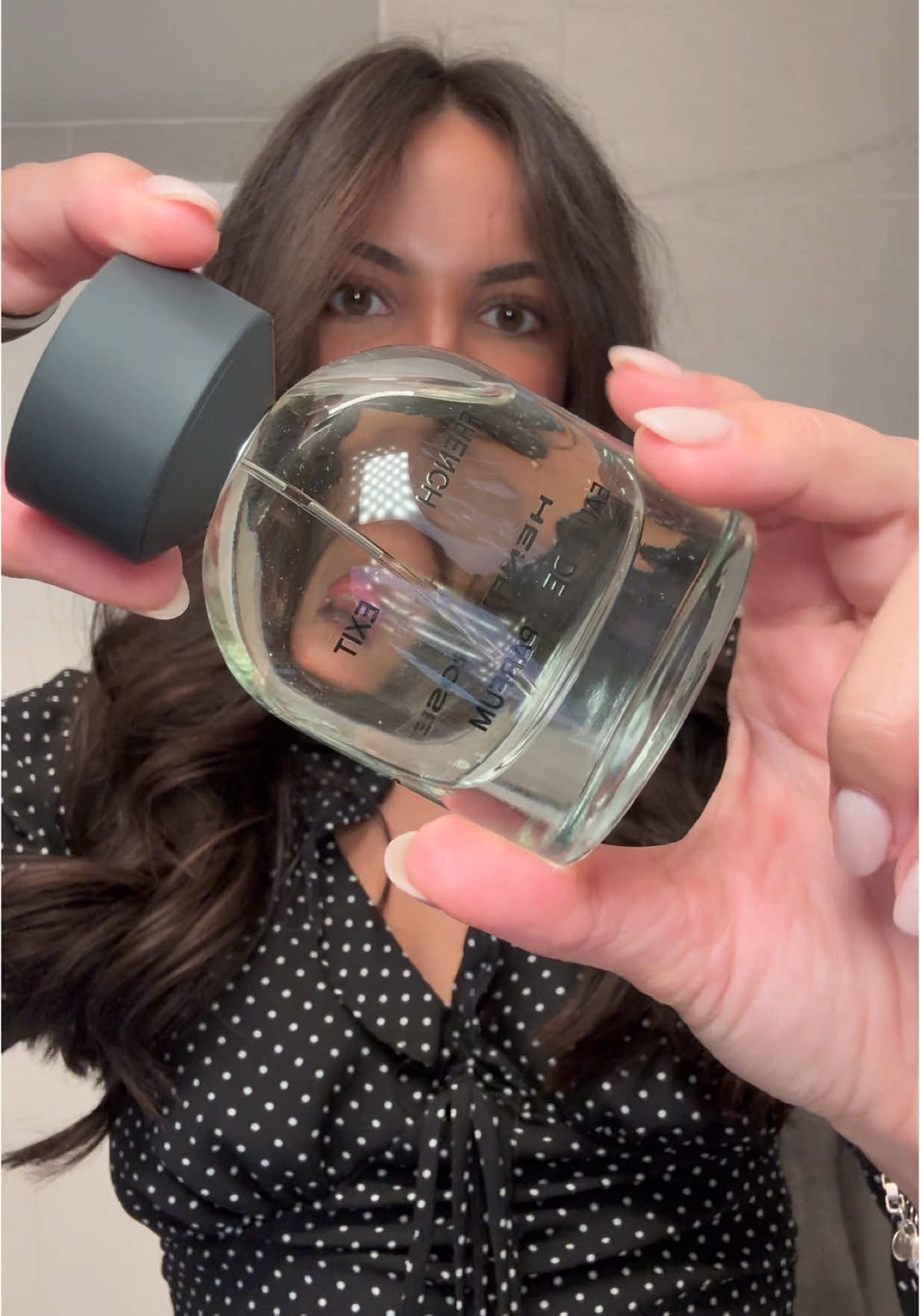 TikTok post by @gabrielaffaria for Henry Rose. Caption reads: [...] cool girl fragrance🌹 French Exit by @Henry....