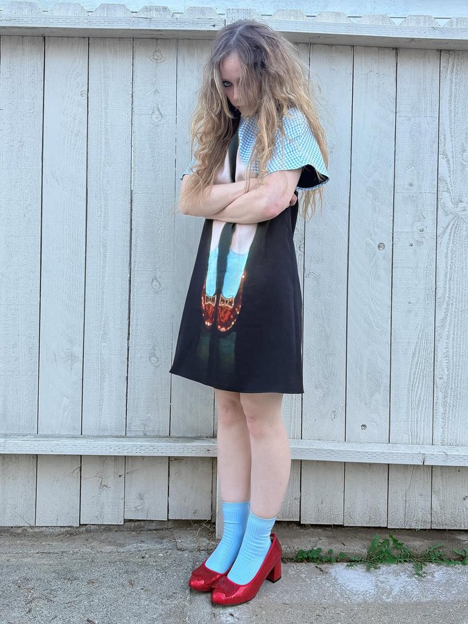 Instagram post by @suzannason for Moschino. Caption reads: there truuly is no place like home 🏚️🧹.