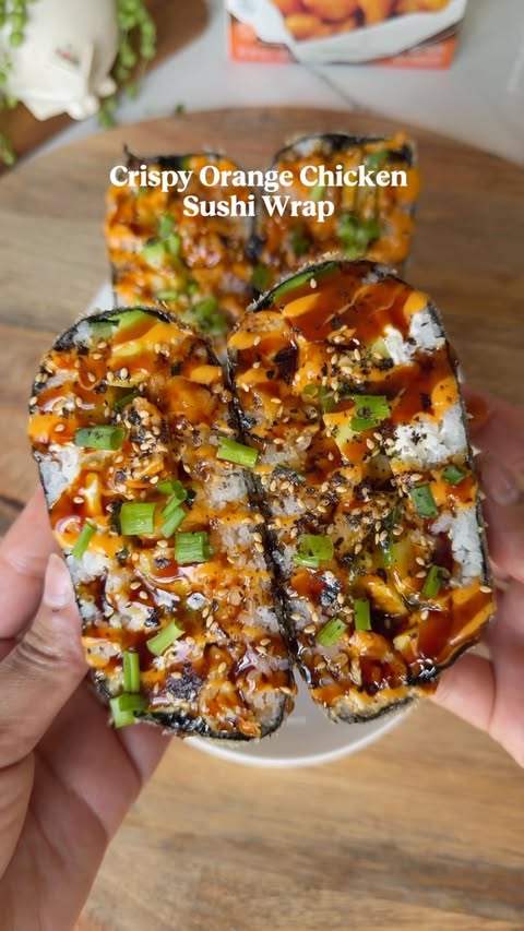 Instagram post by @platedbyyuri for InnovAsian Cuisine. Caption reads: Crispy Orange Chicken Sushi Wrap 🍊🍣....