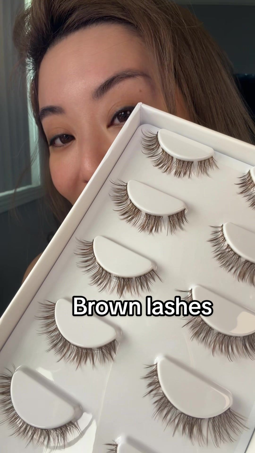 TikTok post by @lifewithnerissa for FlutterHabit. Caption reads: Are you looking for brown lashes? @flutterhabit....