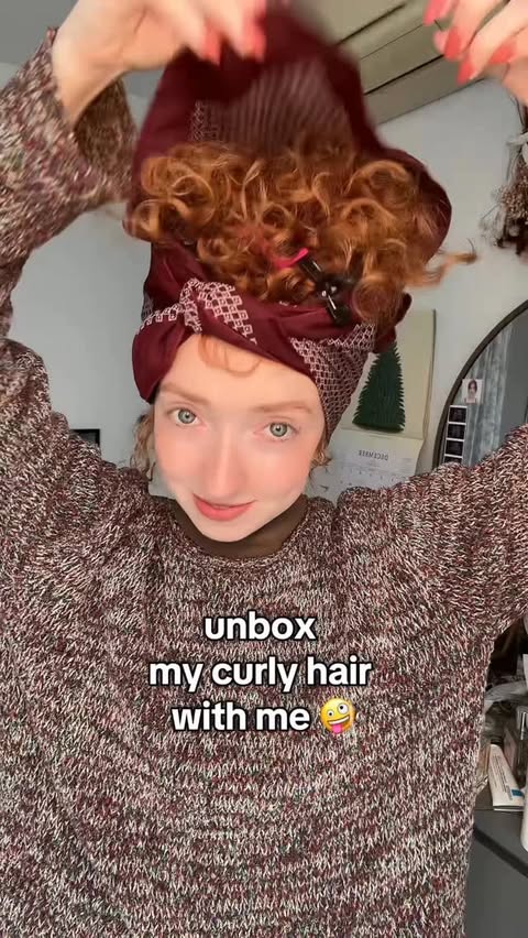 Instagram post by @annaredhair_ for OLAPLEX. Caption reads: curls have a mind of their own ! using the....