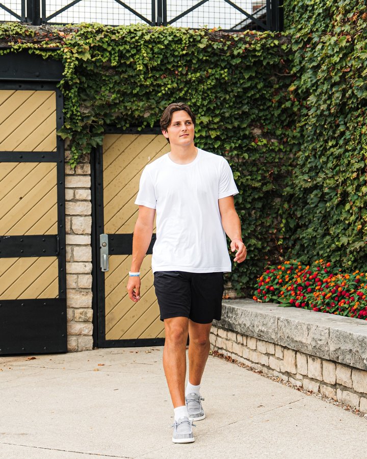 Instagram post by @juliansayin for HEYDUDE. Caption reads: Reppin’ the OSU gray before game day 🏈 @heydude....