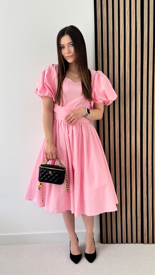 Instagram post by @lototska_natalia_ for Poet Dresses. Caption reads: [...] favorite 🌸 This pink dress from....