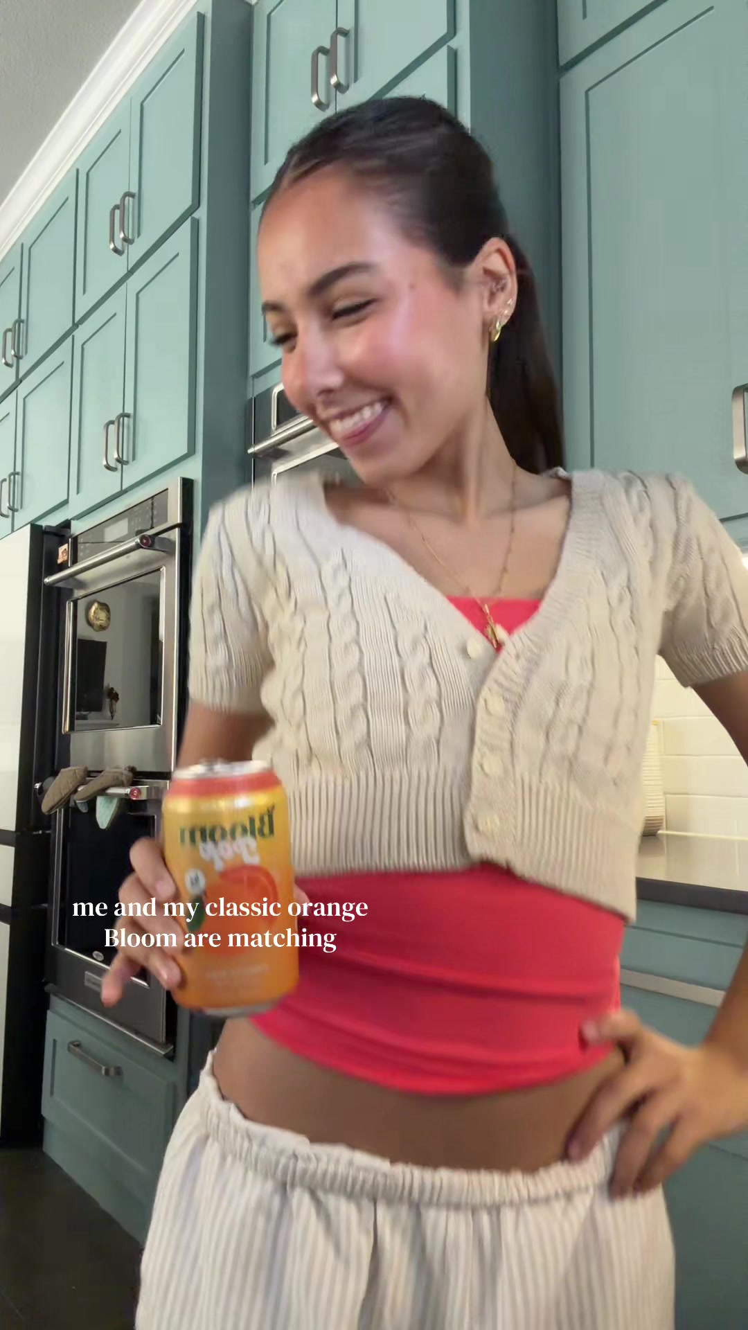 TikTok post by @talinebakr for Bloom Nutrition. Caption reads: matchy matchy with my drink 🍊😄 @Bloom Nutrition....