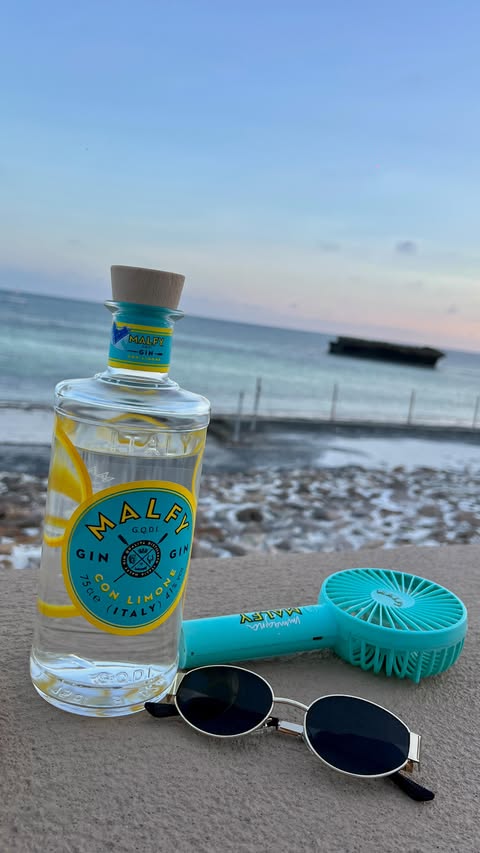 Instagram post by @joanmelly_ for MALFY Gin. Caption reads: Glimpse of the perfect vacation with my favorite....