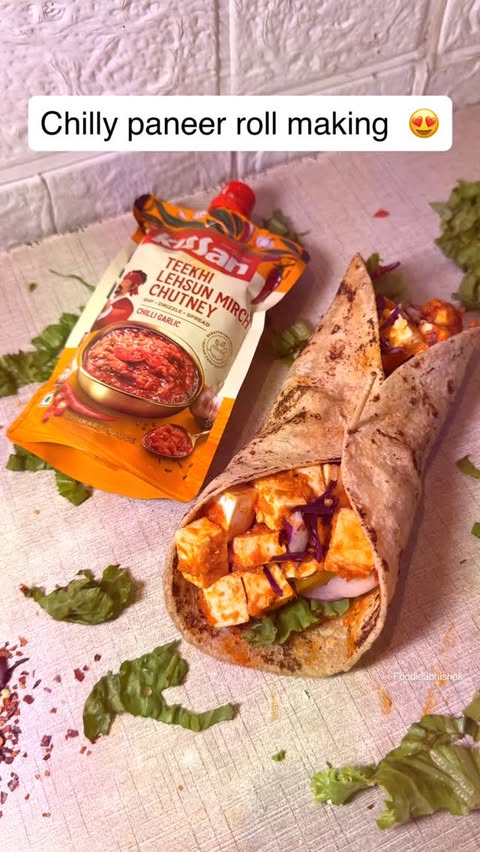 Instagram post by @foodie.abhishek_ for Kissan. Caption reads: Chilly paneer roll making 😍 #ad #kissan....