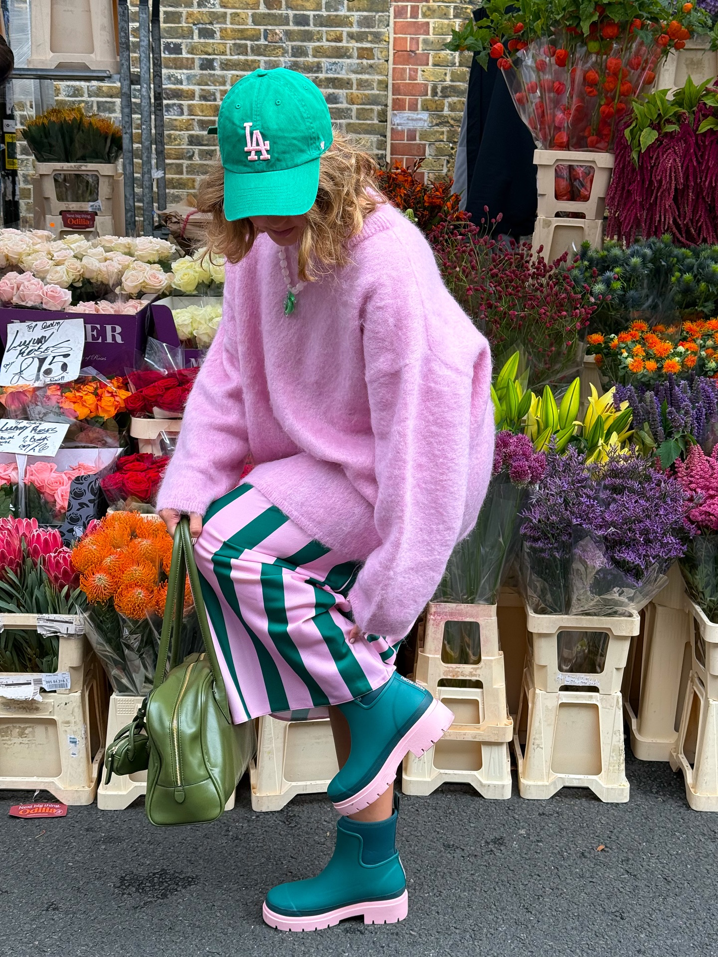 Instagram post by @styled.daisy for Merry People. Caption reads: ad | Fresh blooms, fresh boots 💐👢The....