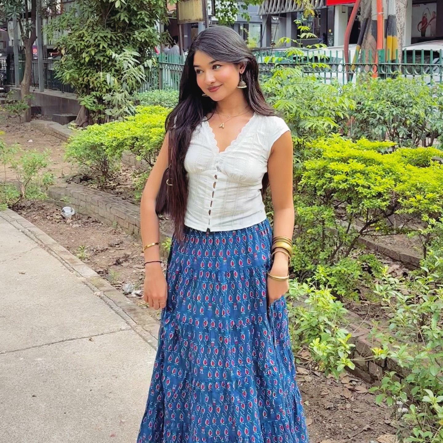 Instagram post by @avnii.sharmaa for NEWME. Caption reads: smells like spring🌼🦢💌 outfit from @newme.asia....