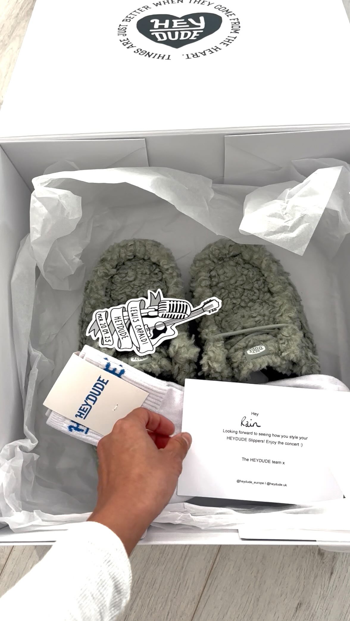 Instagram post by @_raincastillo for HEYDUDE. Caption reads: 🎤BIG ANNOUNCEMENT! 🎉 

I’ve teamed up with....