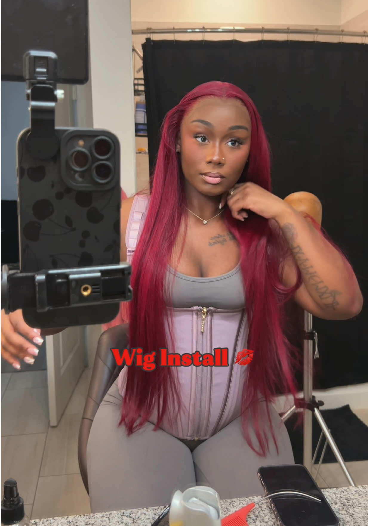 TikTok post by @thedollanaria for Forgirl Forever Wig. Caption reads: Ditch the basic black and let this 99J Burgundy....
