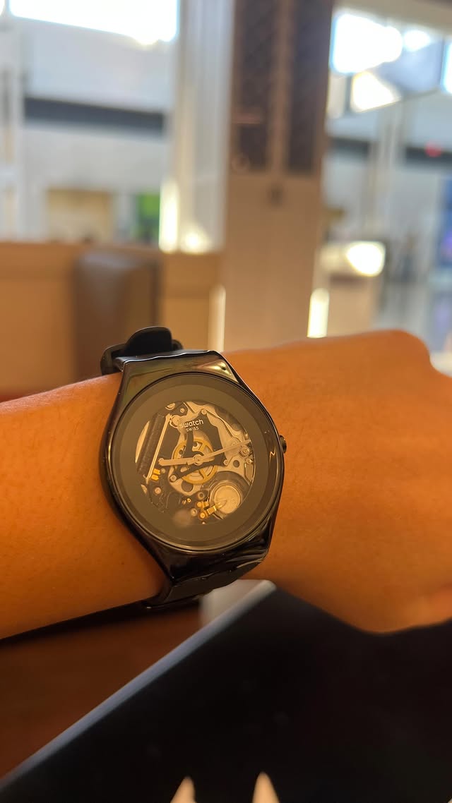 Instagram post by @imanetarib.md for Swatch. Caption reads: [...] #punctuality #time #timeoff #swatch.