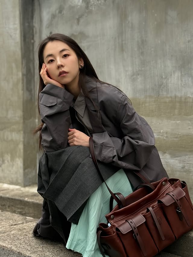 Instagram post by @ssoheean for Prada. Caption reads: Daily route? Route Bag🤎🩶🩵 @prada #PradaSS26....