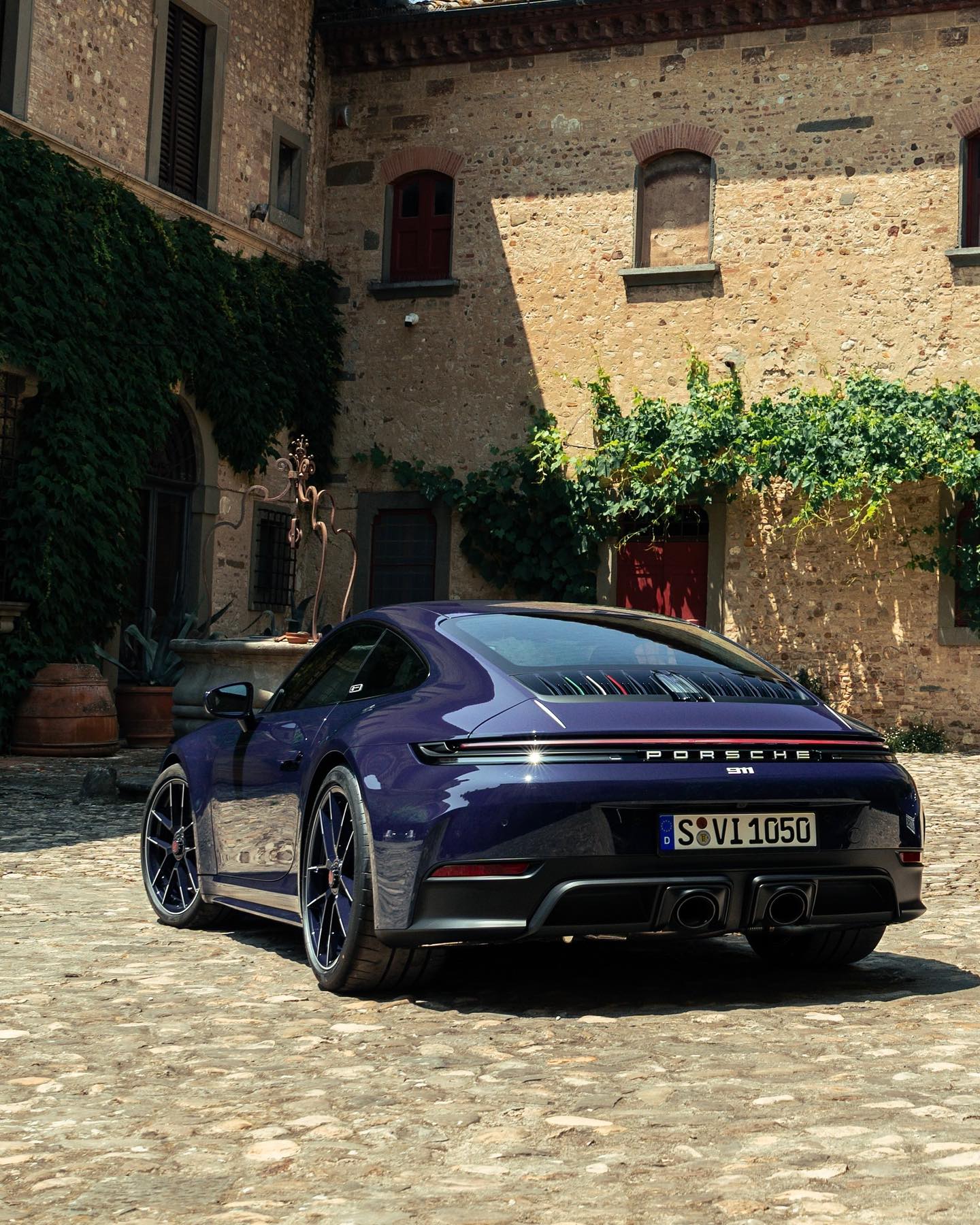 Instagram post by @porsche_newsroom for FERRAGAMO. Caption reads: An Italian dream in Blusogno ... Watch as the....