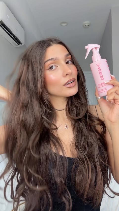 Instagram post by @alexandriashekian for DESIGNME Hair. Caption reads: beachy waves in a bottle ✨ @designmehair....