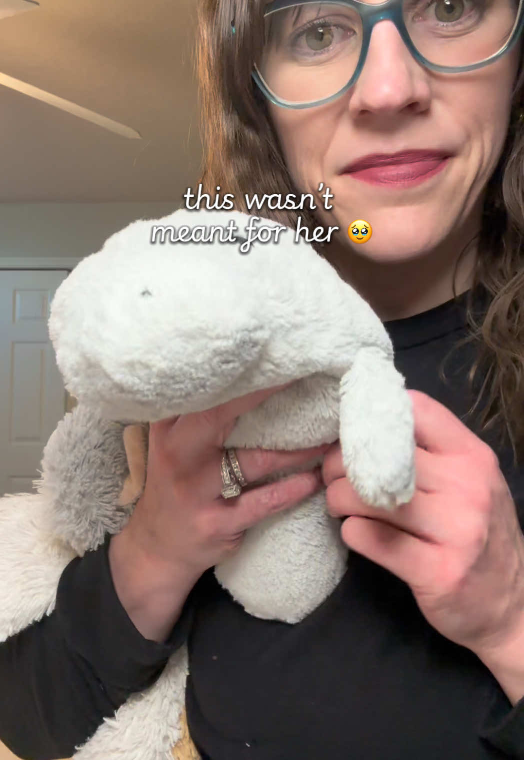 TikTok post by @itsashleefay for Warmies. Caption reads: Warmies junior manatee became her instant [...].