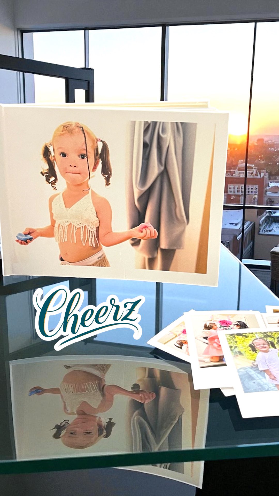 Instagram post by @baby_model_rose_chanel_chloe for Cheerz. Caption reads: Scopri come rivivere i tuoi momenti più belli con....