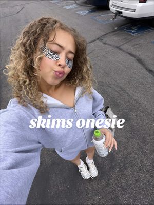 TikTok post by @maliaelaine for Skims. Caption reads: [...] ordering another one in black 🩶 @SKIMS....