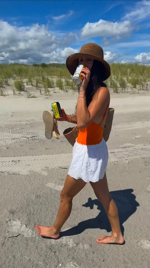 Instagram post by @beccahimsworth for Athletic Brewing Co. Caption reads: Beach days & cold brews with a little more....