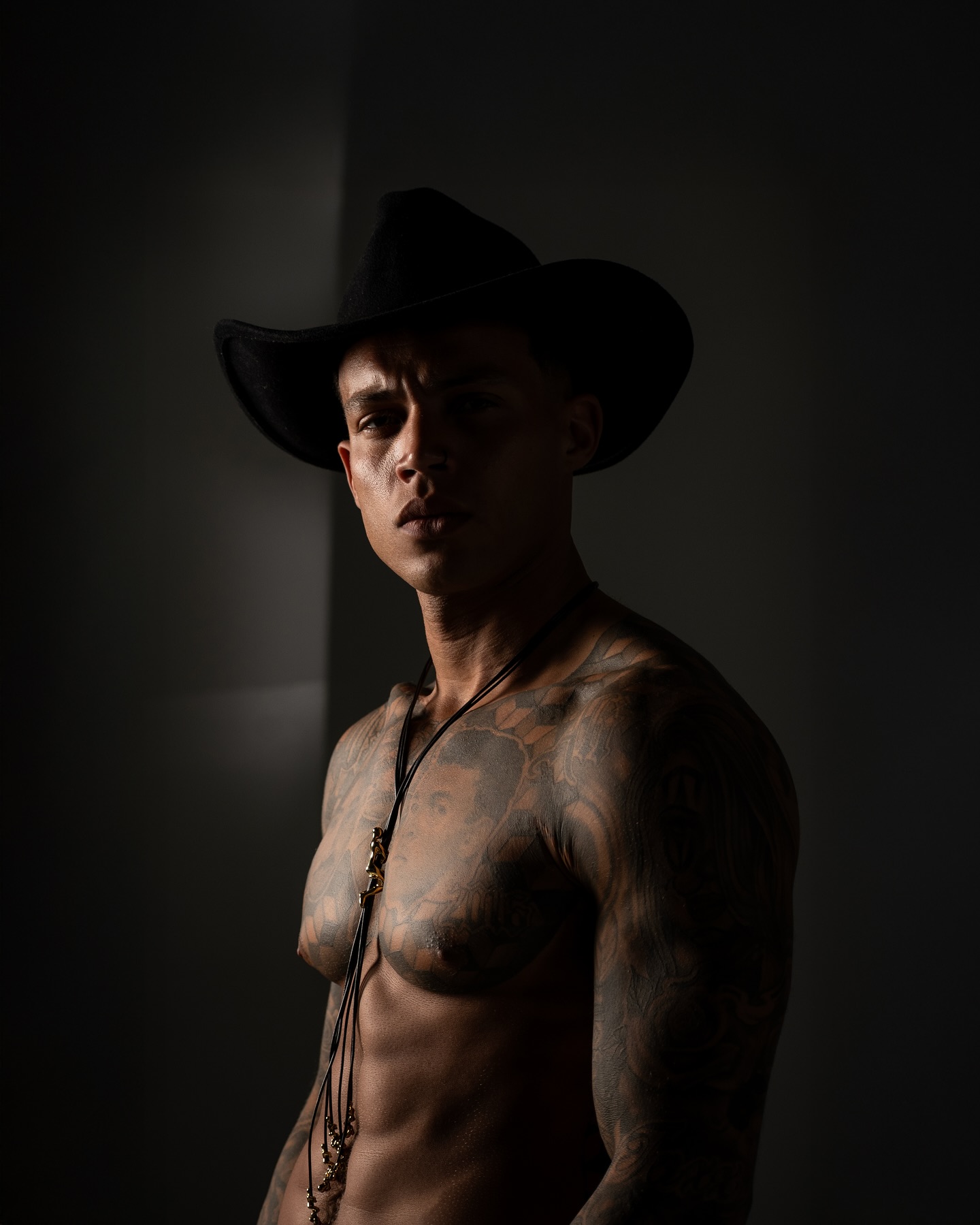 Instagram post by @andryeze for NikonUSA. Caption reads: No shirt, no rules — just boots, grit, and a....