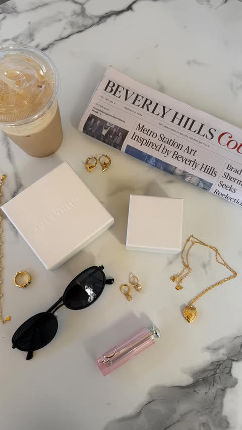 Instagram post by @bymarialab_ for En Route Jewelry. Caption reads: [...] and En Route 🪽💍 ☕️ @enroutejewelry_ Shop....