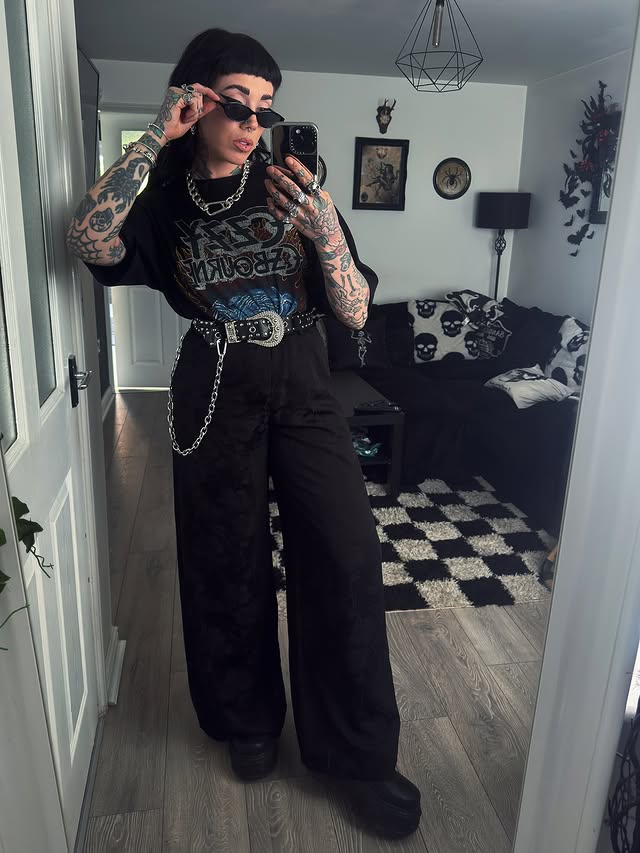 Instagram post by @amylouisehansonxo for KILLSTAR. Caption reads: [...] wear black..🖤⛓️ Outfit 🏷️ Trousers -....