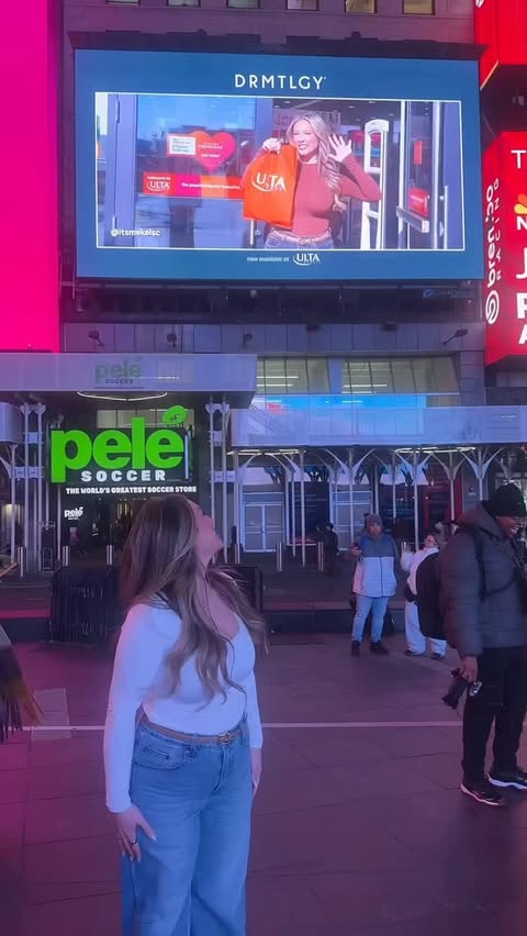 Instagram post by @itsmekelsc1 for DRMTLGY. Caption reads: [...] A BILLBOARD IN TIMES SQUARE!! Omg 😭😭 thank....