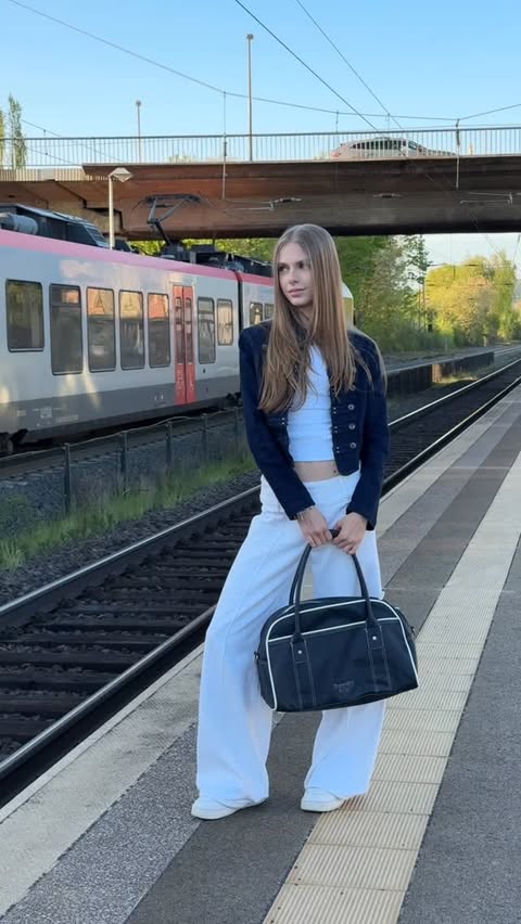 Instagram post by @nelly.opitz for Superdry. Caption reads: Love this bag 👜 from @superdry | ad.