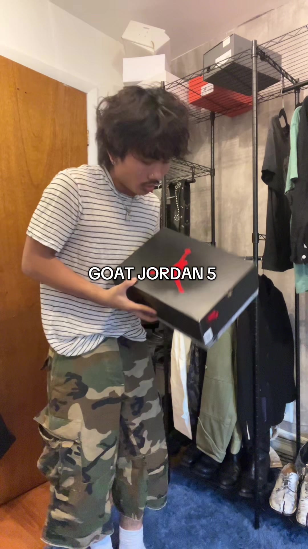 TikTok post by @dannyw1n for GOAT. Caption reads: Unboxing the Fire Red Air Jordan 5s from @GOAT ....
