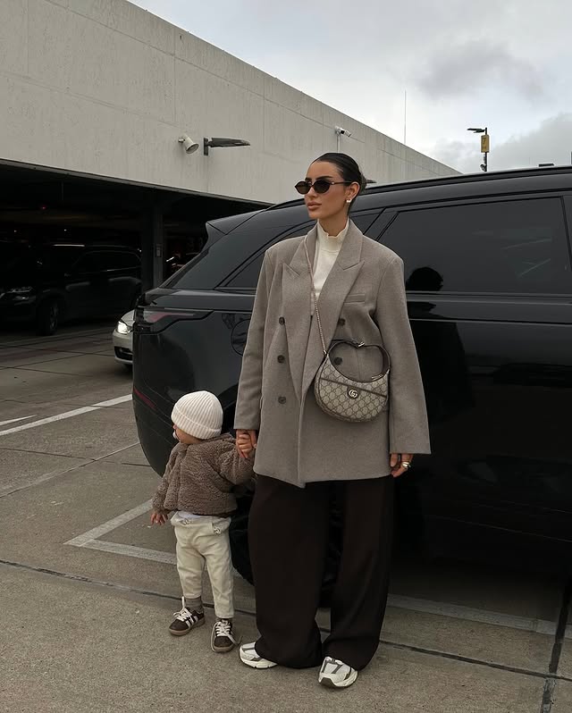 Instagram post by @dilarakaynarca for Land Rover. Caption reads: your fav range mom & son duo. 🖤 #momlife #babyboy....