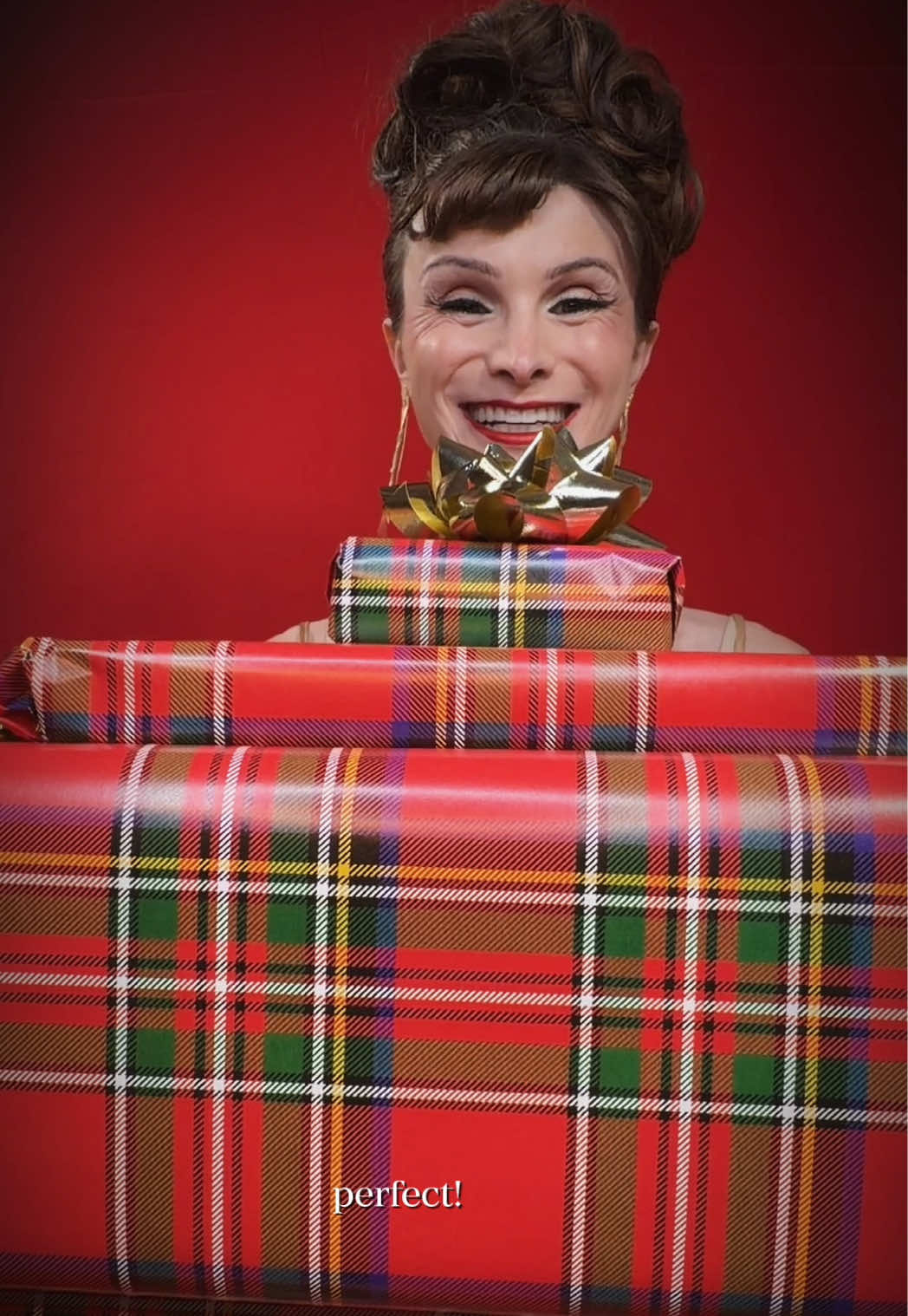 TikTok post by @dylanmulvaney for JeanPaulGaultier. Caption reads: [...] 👀🎄 Gaultier Divine Le Parfum by....