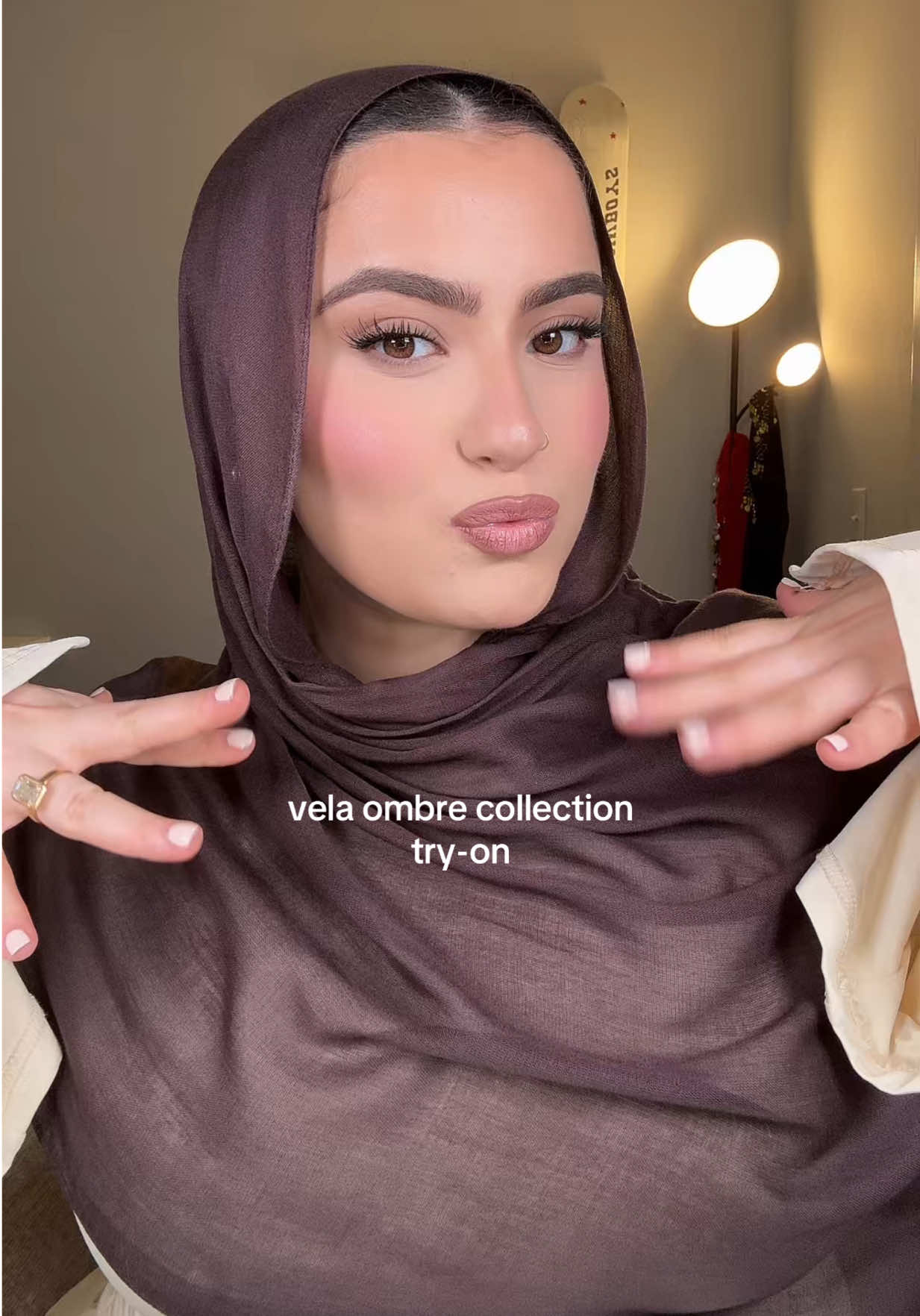 TikTok post by @sallypoo for VELA. Caption reads: try on vela’s new ombre hijabs :3 so cute idk....