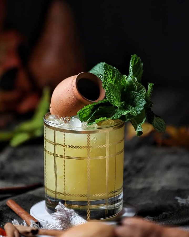 Instagram post by @the_garnishguy for HuffPost. Caption reads: Can you guess what's inside the mini clay barrel?....