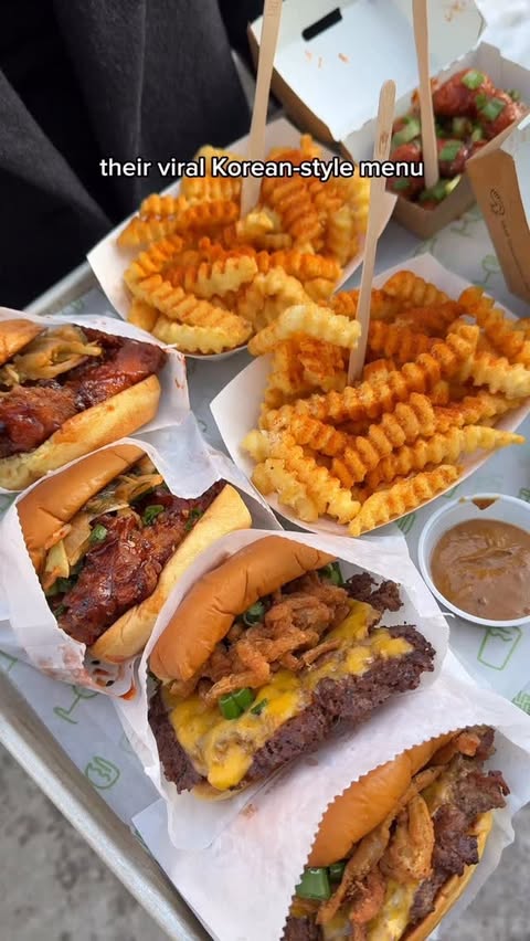 Instagram post by @tooomuchfoood for Shake Shack. Caption reads: @ShakeShack’s Korean-style menu is back for the....
