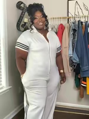 TikTok post by @ninamoses1 for uoozee. Caption reads: @UOOZEE USA 🤍🖤 Jumpsuit ✨ [...].